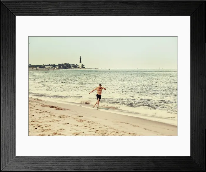 Framed Print : Florida, South Florida, Surfer with Hillsboro Inlet Lighthouse in background Framed Print : Florida, South Florida, Surfer with Hillsboro Inlet Lighthouse in background