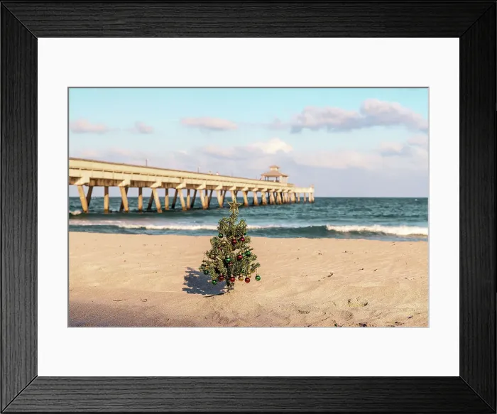 Framed Print : Christmas tree at beach scene with pier in background Framed Print : Christmas tree at beach scene with pier in background
