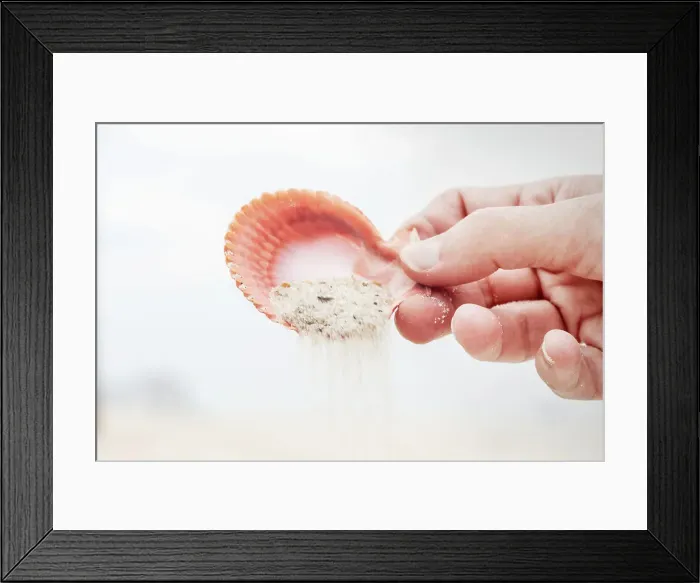 Framed Print : Pouring sand with seashell