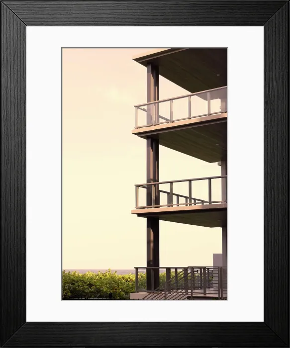 Framed Print : Modern building in front of ocean