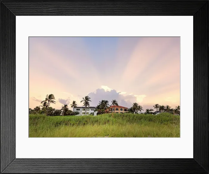 Framed Print : Houses overlooking the ocean with dramatic sky in background
