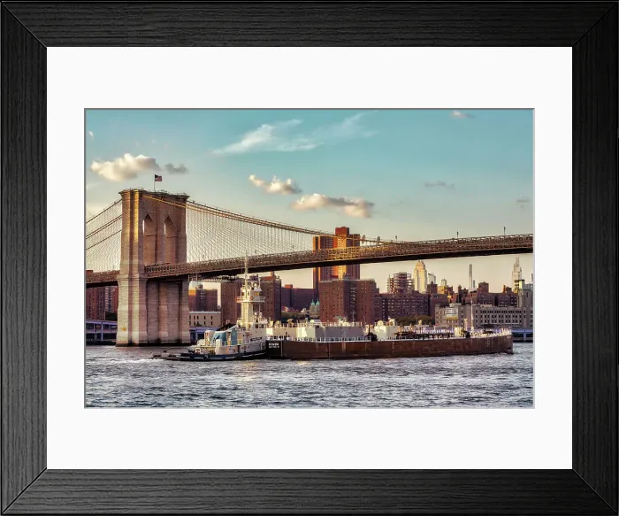 Framed Print : New York City, views of Manhattan through Brooklyn Bridge, barge under bridge Framed Print : New York City, views of Manhattan through Brooklyn Bridge, barge under bridge