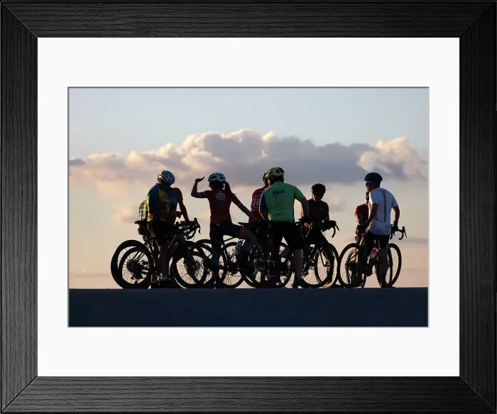 Framed Print : Group of cyclists silhouetted at sunset Framed Print : Group of cyclists silhouetted at sunset