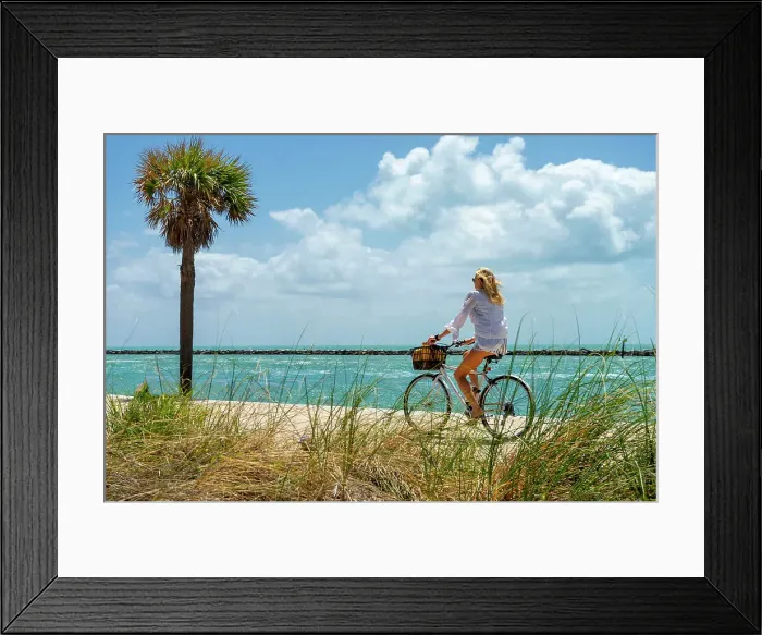 Framed Print : Florida, Miami Beach, South Pointe Park, Woman biking on the beach Framed Print : Florida, Miami Beach, South Pointe Park, Woman biking on the beach
