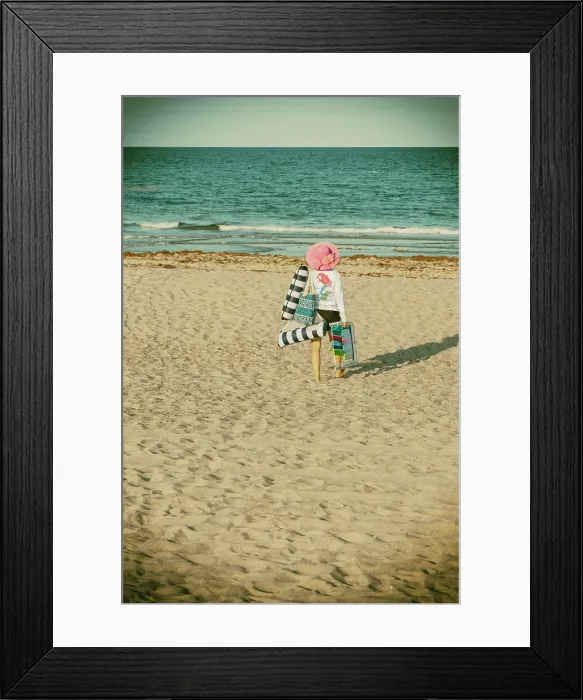 Framed Print : Woman on vacation walking on the beach Framed Print : Woman on vacation walking on the beach