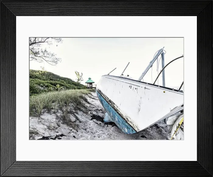 Framed Print : Boat wreck on beach with lifeguard tower in background Framed Print : Boat wreck on beach with lifeguard tower in background