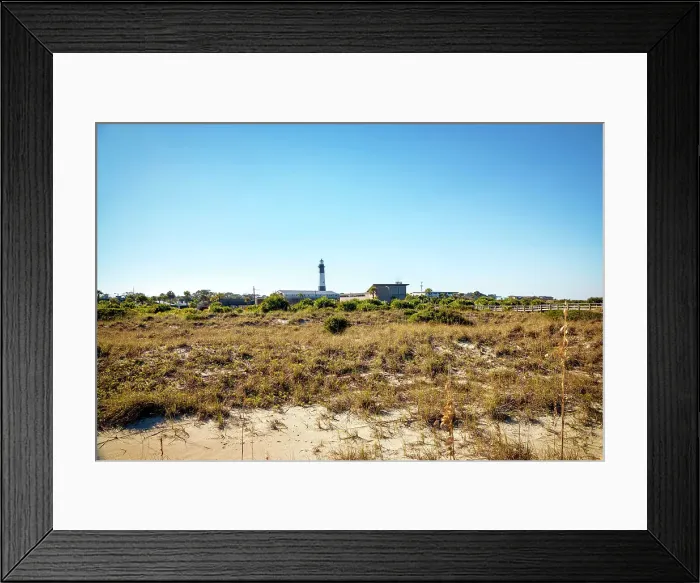 Framed Print : Georgia, Tybee Island, Tybee Lighthouse seen through sand dunes Framed Print : Georgia, Tybee Island, Tybee Lighthouse seen through sand dunes
