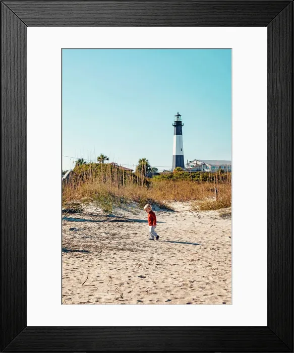 Framed Print : Georgia, Tybee Island, boy at beach with Tybee Lighthouse in background Framed Print : Georgia, Tybee Island, boy at beach with Tybee Lighthouse in background