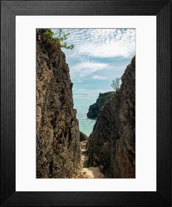 Framed Print : Bermuda, View of beach through narrow gap between rocks Framed Print : Bermuda, View of beach through narrow gap between rocks
