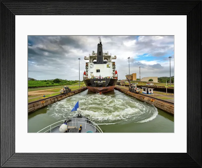 Framed Print : Panama, Panama City, Panama Canal, cargo ship with mule locomotives guiding passage Framed Print : Panama, Panama City, Panama Canal, cargo ship with mule locomotives guiding passage