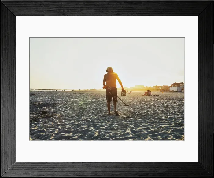 Framed Print : New York, Long Island, Long Beach, Man with metal detector beachcombing