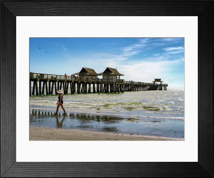 Framed Print : Florida, Naples, Fishing Pier, Woman strolling on the beach