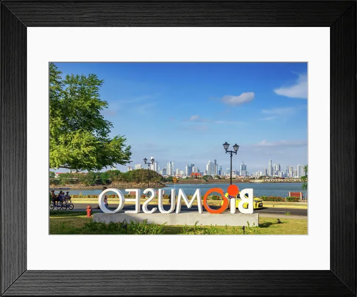 Framed Print : Panama, Panama City, Amador Causeway, Biomuseo sign with view of city skyline in the background Framed Print : Panama, Panama City, Amador Causeway, Biomuseo sign with view of city skyline in the background