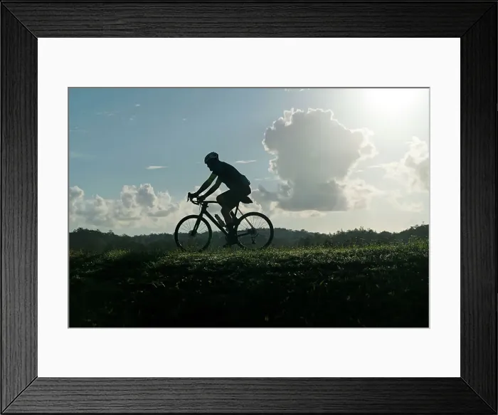 Framed Print : Silhouette of man riding bicycle Framed Print : Silhouette of man riding bicycle