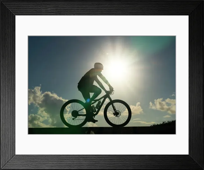 Framed Print : Silhouette of man riding bicycle Framed Print : Silhouette of man riding bicycle