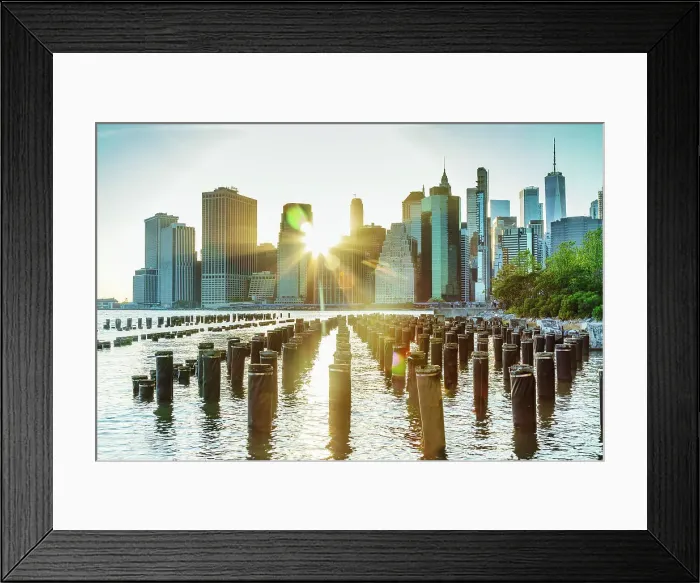 Framed Print : New York City, East River, Manhattan, Lower Manhattan, downtown skyline at sunrise from Brooklyn Bridge Park, pier pilings Framed Print : New York City, East River, Manhattan, Lower Manhattan, downtown skyline at sunrise from Brooklyn Bridge Park, pier pilings