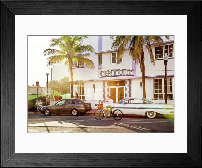Framed Print : Florida, South Beach, person riding bicycle in front of Century Hotel Framed Print : Florida, South Beach, person riding bicycle in front of Century Hotel