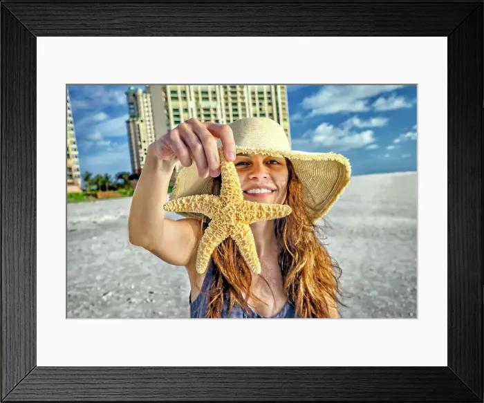 Framed Print : Florida, Marco Island, Beach, woman holding starfish Framed Print : Florida, Marco Island, Beach, woman holding starfish