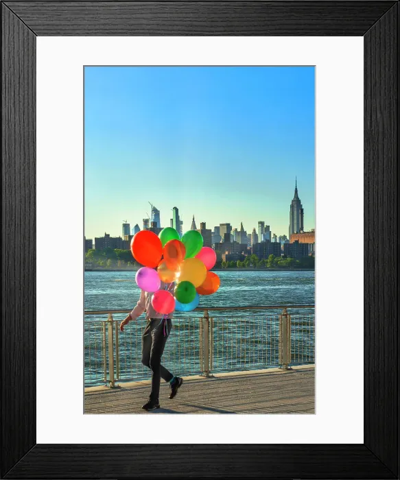 Framed Print : New York City, Brooklyn, Williamsburg, man with balloons walking along the promenade at Domino Park Framed Print : New York City, Brooklyn, Williamsburg, man with balloons walking along the promenade at Domino Park