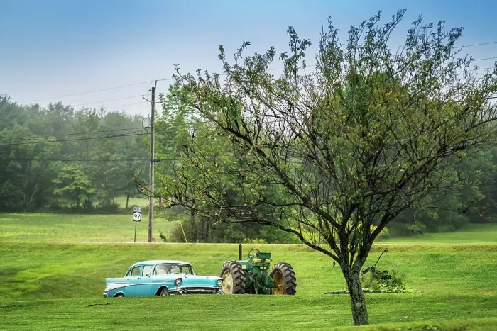Framed Print : Americana scene, sky blue Chevrolet car next to a John Deer tractor Framed Print : Americana scene, sky blue Chevrolet car next to a John Deer tractor