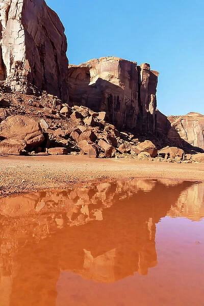 Arizona, Monument Valley, Sand Stone Rocks reflected on water