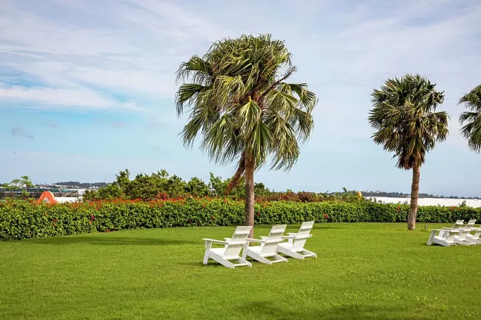 Framed Print : Bermuda, Outdoor chairs on green lawn at Grotto Bay Beach Resort & Spa Framed Print : Bermuda, Outdoor chairs on green lawn at Grotto Bay Beach Resort & Spa