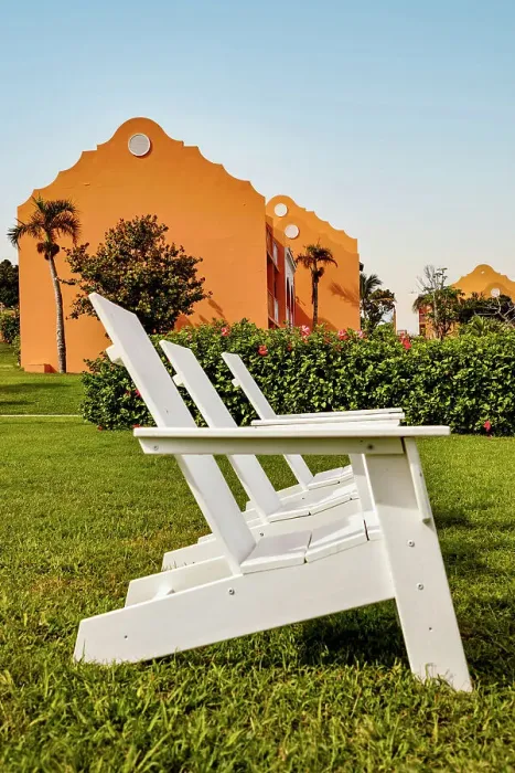 Framed Print : Bermuda, Outdoor chairs on green lawn at Grotto Bay Beach Resort & Spa Framed Print : Bermuda, Outdoor chairs on green lawn at Grotto Bay Beach Resort & Spa