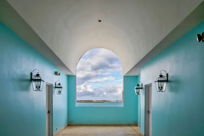 Framed Print : Bermuda, Room with cerulean walls and window with view of Castle Harbor Framed Print : Bermuda, Room with cerulean walls and window with view of Castle Harbor