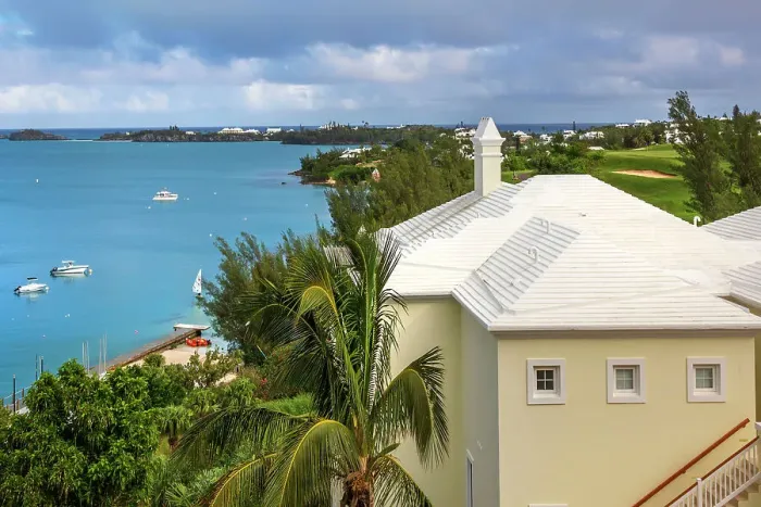 Framed Print : Bermuda, view of Castle Harbor waterfront with cerulean ocean and iconic white rooftop