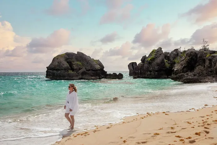 Framed Print : Bermuda, Warwick Long Bay, woman walking on beach with aquamarine water and pink sand Framed Print : Bermuda, Warwick Long Bay, woman walking on beach with aquamarine water and pink sand
