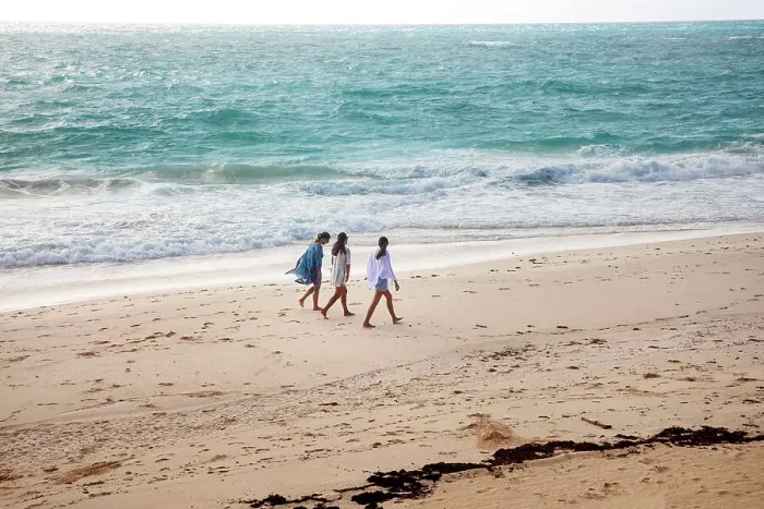 Framed Print : Bermuda, women strolling on private beach at Rosewood Bermuda Hotel