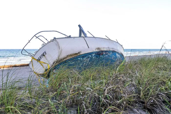Framed Print : Boat wreck on beach