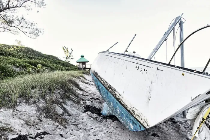 Framed Print : Boat wreck on beach with lifeguard tower in background Framed Print : Boat wreck on beach with lifeguard tower in background