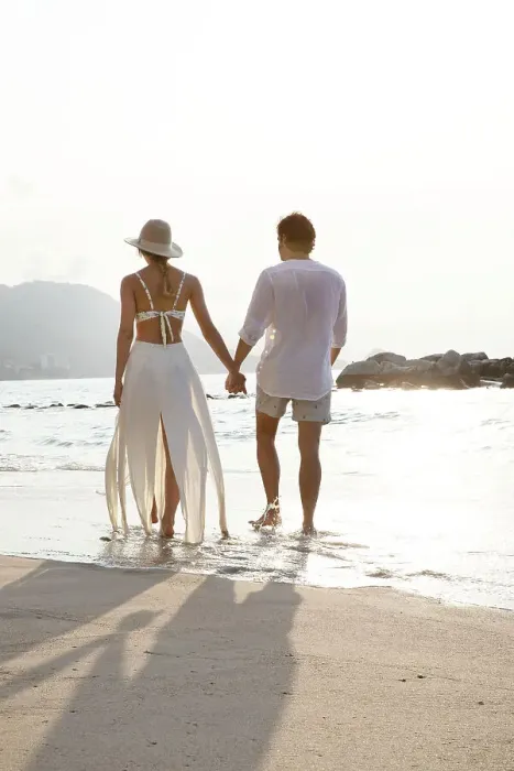 Framed Print : Couple walking along beach Framed Print : Couple walking along beach
