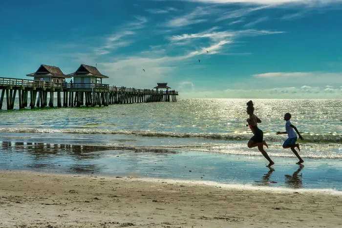 Framed Print : Florida, Naples, Fishing Pier, kids running on the beach Framed Print : Florida, Naples, Fishing Pier, kids running on the beach