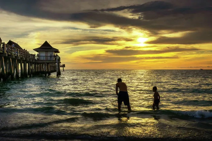 Framed Print : Florida, Naples, Fishing Pier, Playing on the beach Framed Print : Florida, Naples, Fishing Pier, Playing on the beach