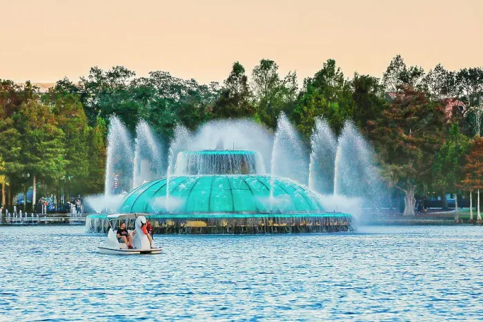 Framed Print : Florida, Orlando, Lake Eola Park, Fountain and Swan paddle boat