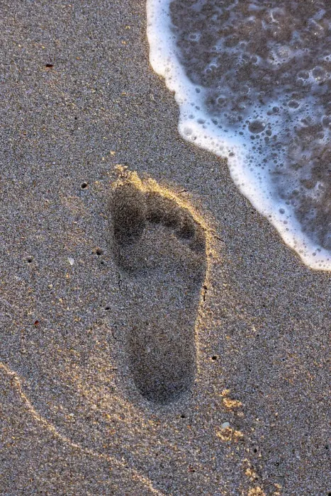 Framed Print : Footprint on sand with wave Framed Print : Footprint on sand with wave