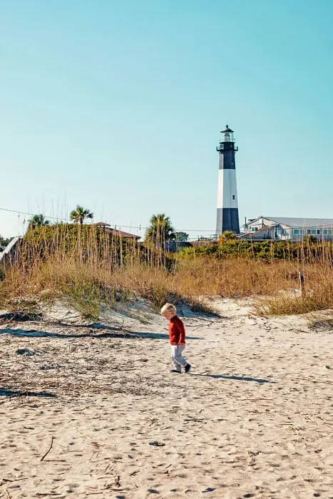 Framed Print : Georgia, Tybee Island, boy at beach with Tybee Lighthouse in background Framed Print : Georgia, Tybee Island, boy at beach with Tybee Lighthouse in background
