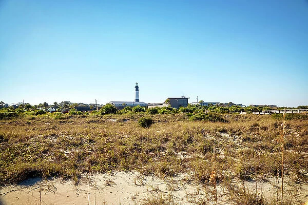 Georgia, Tybee Island, Tybee Lighthouse seen through sand dunes