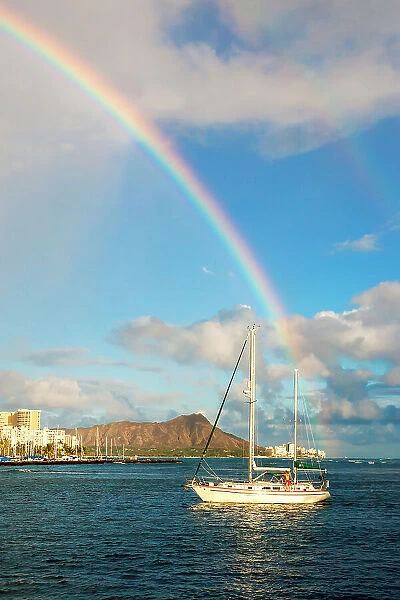 Hawaii, Oahu, Honolulu, View of Diamond Head coastline, rainbow across the sky