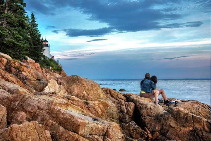 Framed Print : Maine, Bass Harbor, Couple on Rocks by Bass Harbor Head Lighthouse