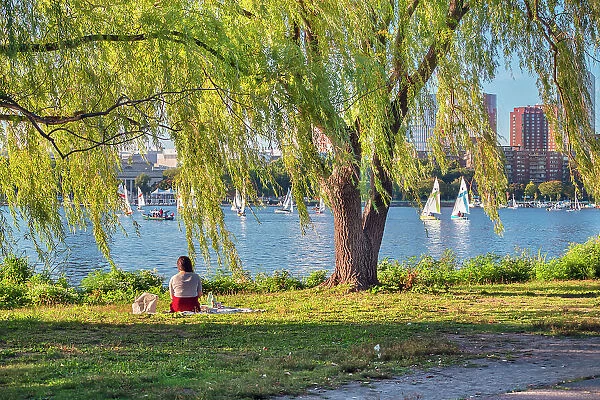 Massachusetts, Boston, Charles River Esplanade park, woman relaxing