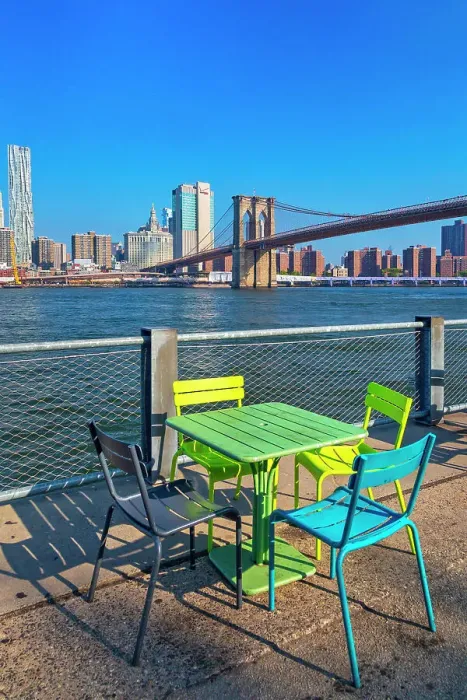 Framed Print : New York City, Brooklyn, Colorful chairs and tables in Brooklyn Bridge Park with view of Manhattan Framed Print : New York City, Brooklyn, Colorful chairs and tables in Brooklyn Bridge Park with view of Manhattan