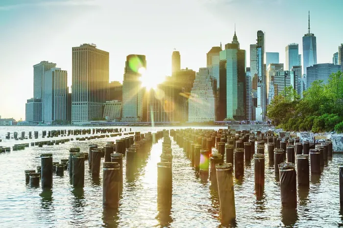 Framed Print : New York City, East River, Manhattan, Lower Manhattan, downtown skyline at sunrise from Brooklyn Bridge Park, pier pilings Framed Print : New York City, East River, Manhattan, Lower Manhattan, downtown skyline at sunrise from Brooklyn Bridge Park, pier pilings