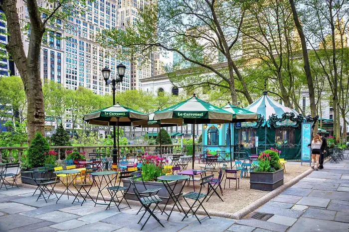 Framed Print : New York City, Manhattan, Bryant Park, sitting area with tables and carousel Framed Print : New York City, Manhattan, Bryant Park, sitting area with tables and carousel