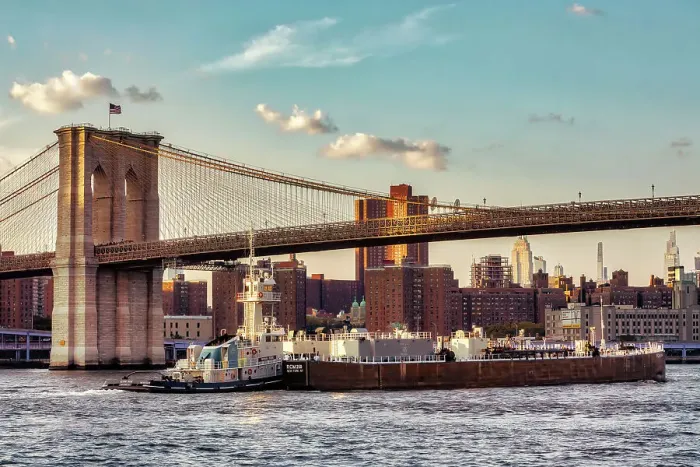 Framed Print : New York City, views of Manhattan through Brooklyn Bridge, barge under bridge Framed Print : New York City, views of Manhattan through Brooklyn Bridge, barge under bridge