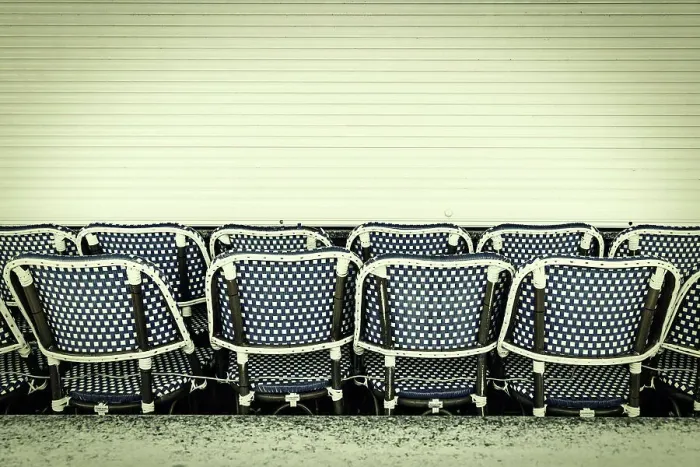 Framed Print : Restaurant chairs lined up