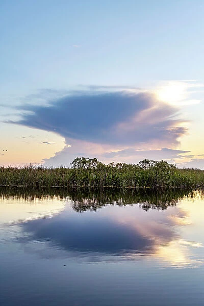 Unusual cloud formation exploding over wetlands
