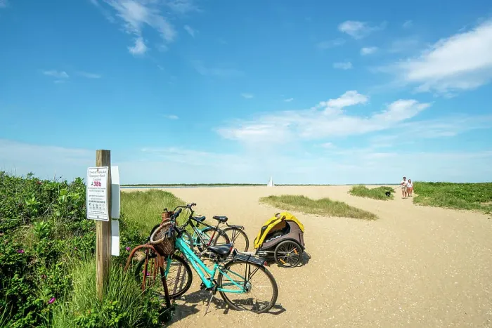 Framed Print : USA, Nantucket, Massachusetts, Brant Point Beach, bicycles parked on the entrance to the beach, couple with dog Framed Print : USA, Nantucket, Massachusetts, Brant Point Beach, bicycles parked on the entrance to the beach, couple with dog